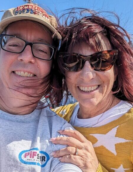 PIFster co-founders smiling. Pay it forward to helping hands.